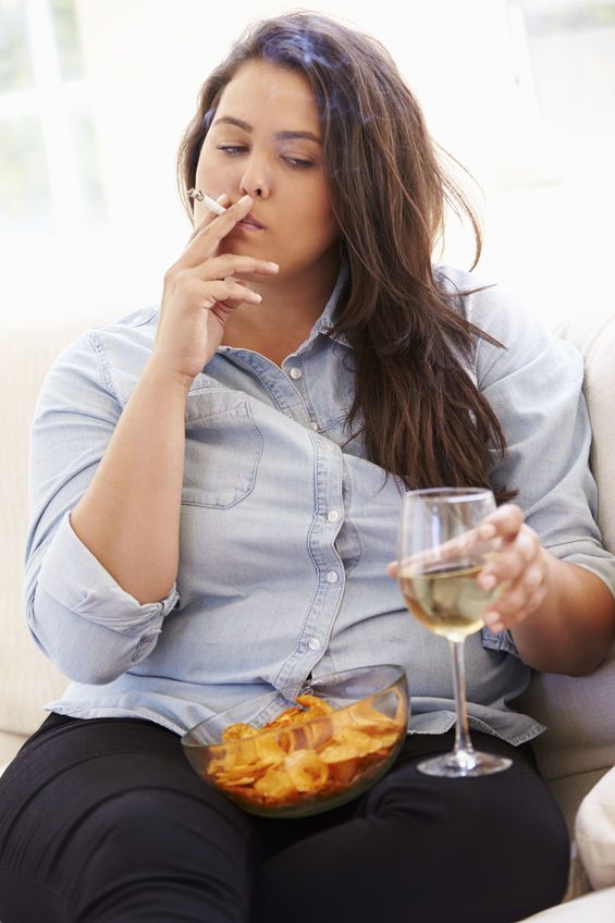 Overweight Woman Eating Chips, Drinking Wine And Smoking Overweight